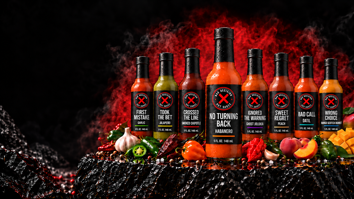 The eight Bad Decision Hot Sauce bottles in a row, including the three new sauces Sweet Regret peach, Bad Call datil and Wrong Choice mango Scotch bonnet