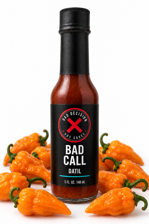 Bad Call datil hot sauce bottle with fresh datil peppers